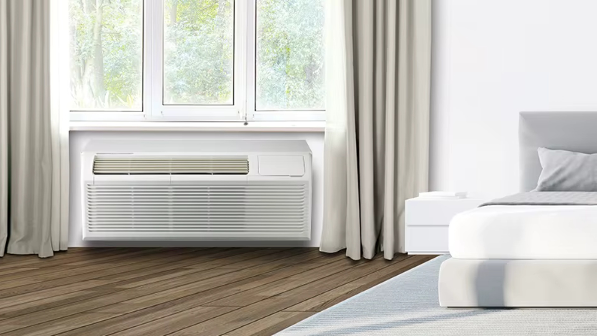 1 GE wall unit AC, vertical air conditioner, and hotel mini fridge providing complete climate control in guest room