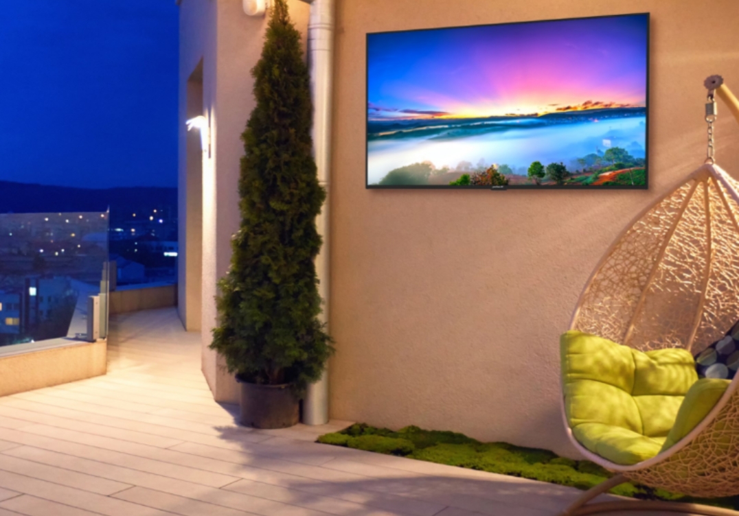 Peerless AV mount with sealed display at hotel courtyard lounge