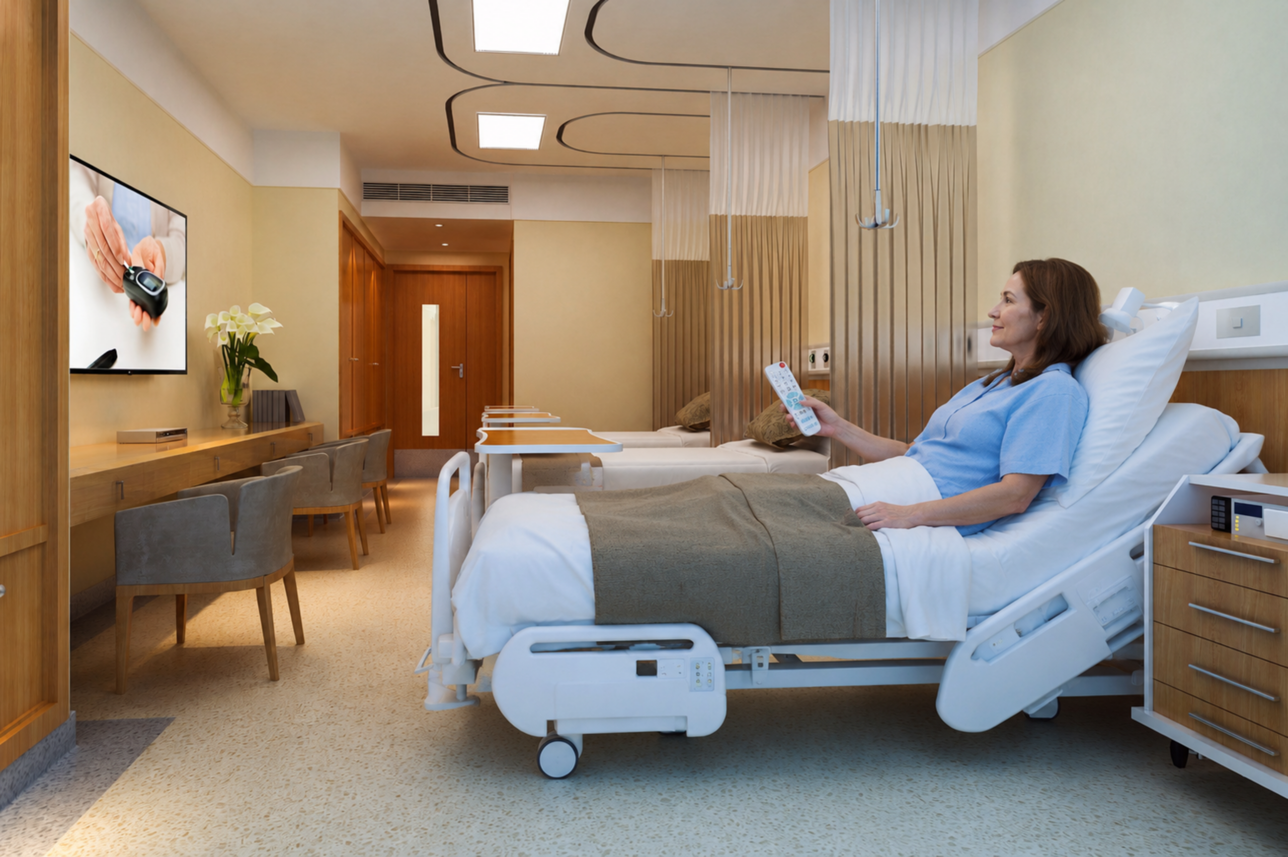 Patient using LG healthcare television and patient engagement technology in a modern hospital patient room.